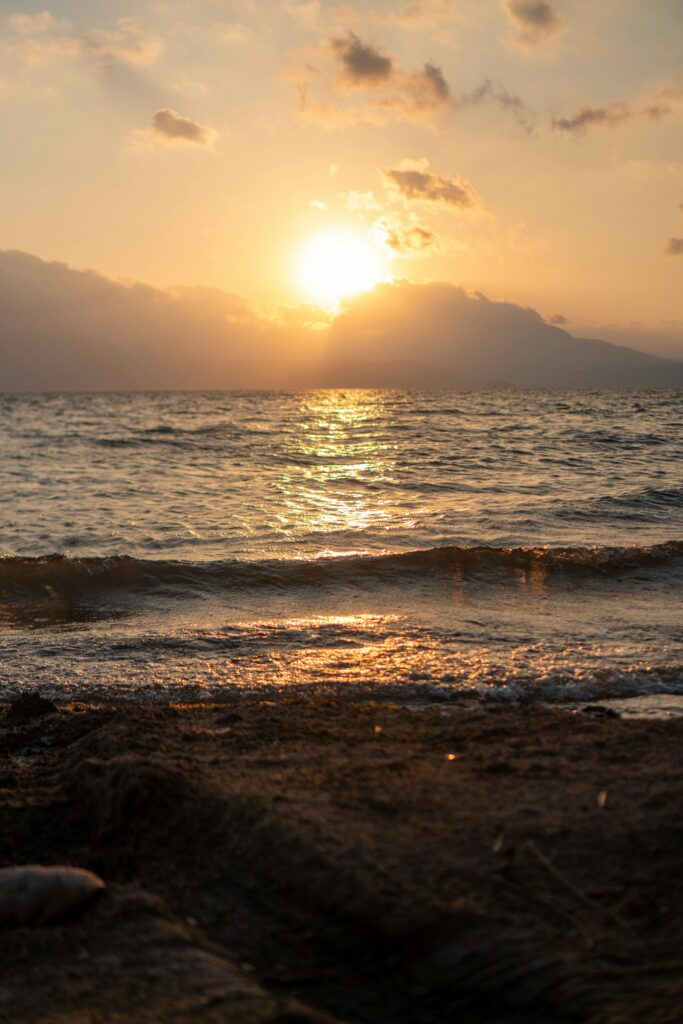 Stunning beach sunset in El Salvador with golden hues and coastal waves.